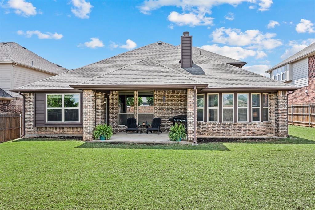5209 Edgebrook Way Fort Worth, TX 76244 - Photo 29 of 33 a house view with a sitting space and garden view