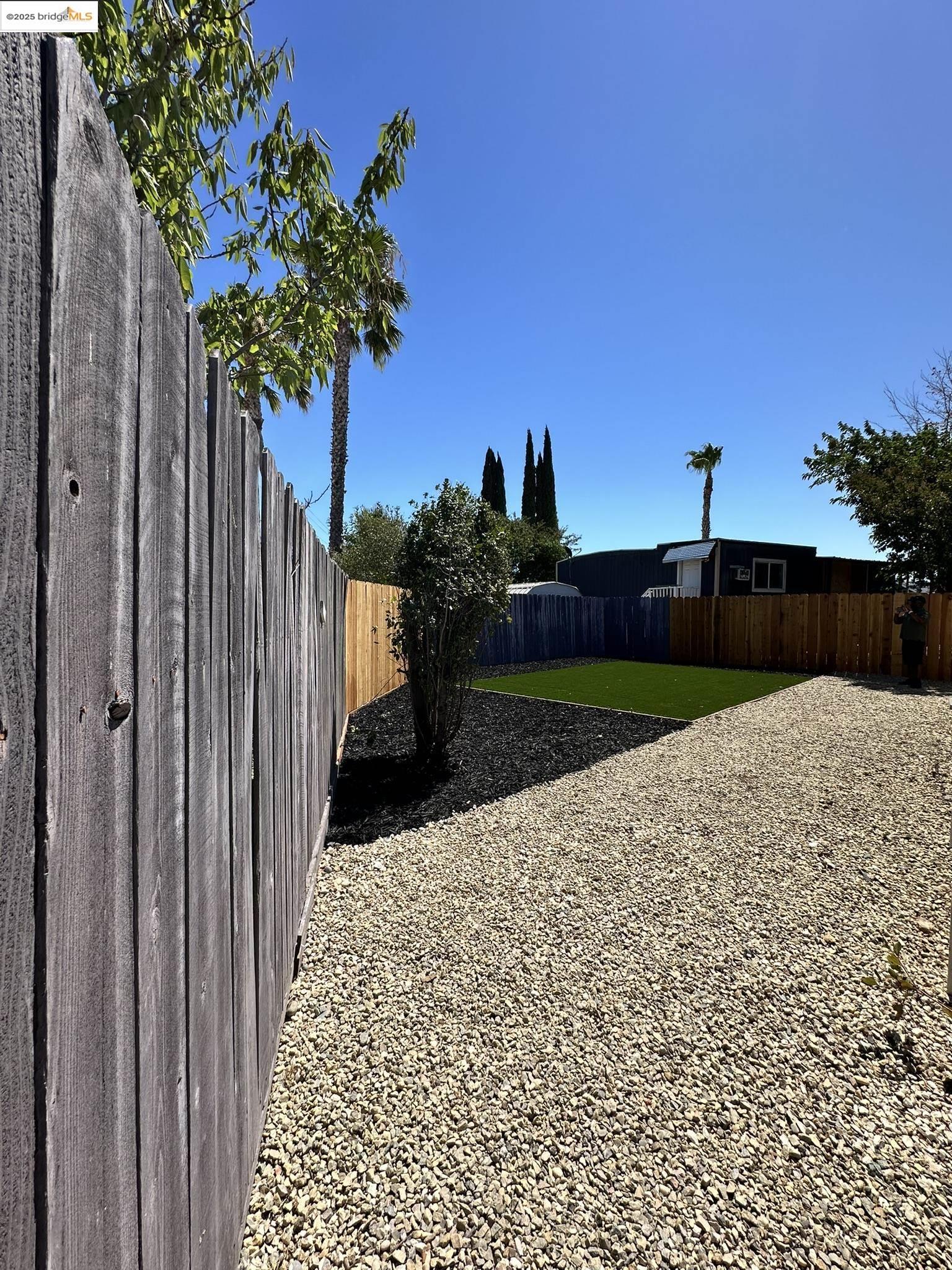 3301 Buchanan Road, Unit 47 Antioch, CA 94509 - Photo 12 of 58 a view of a backyard with a garden