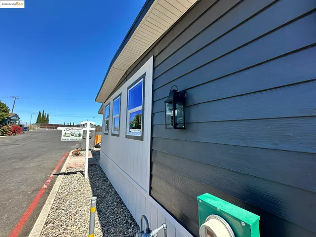 a view of a kitchen center island wooden floor and windows