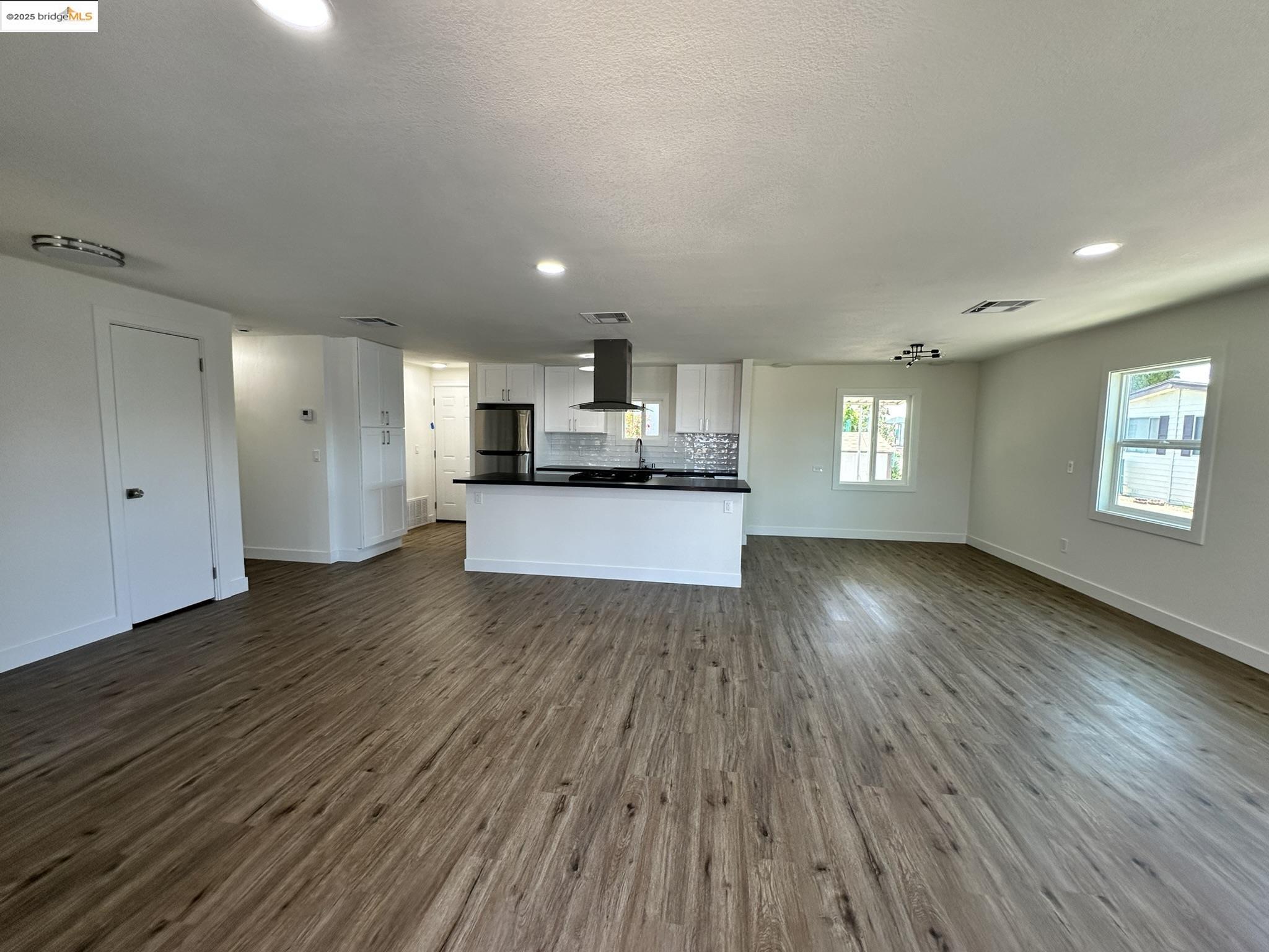 3301 Buchanan Road, Unit 47 Antioch, CA 94509 - Photo 54 of 58 a view of a kitchen center island wooden floor and windows