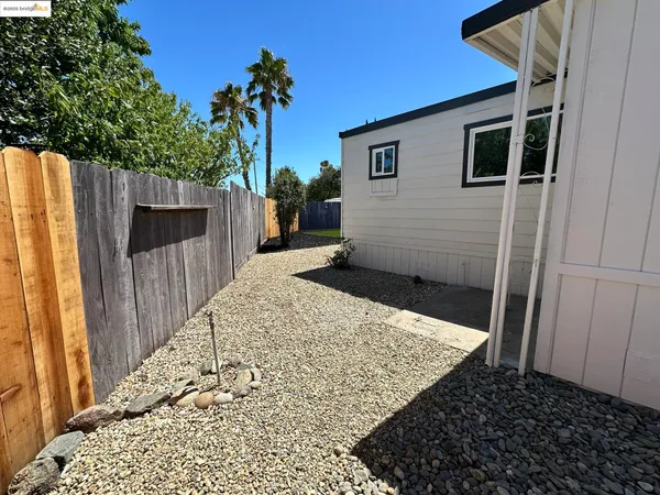 a view of a backyard of the house