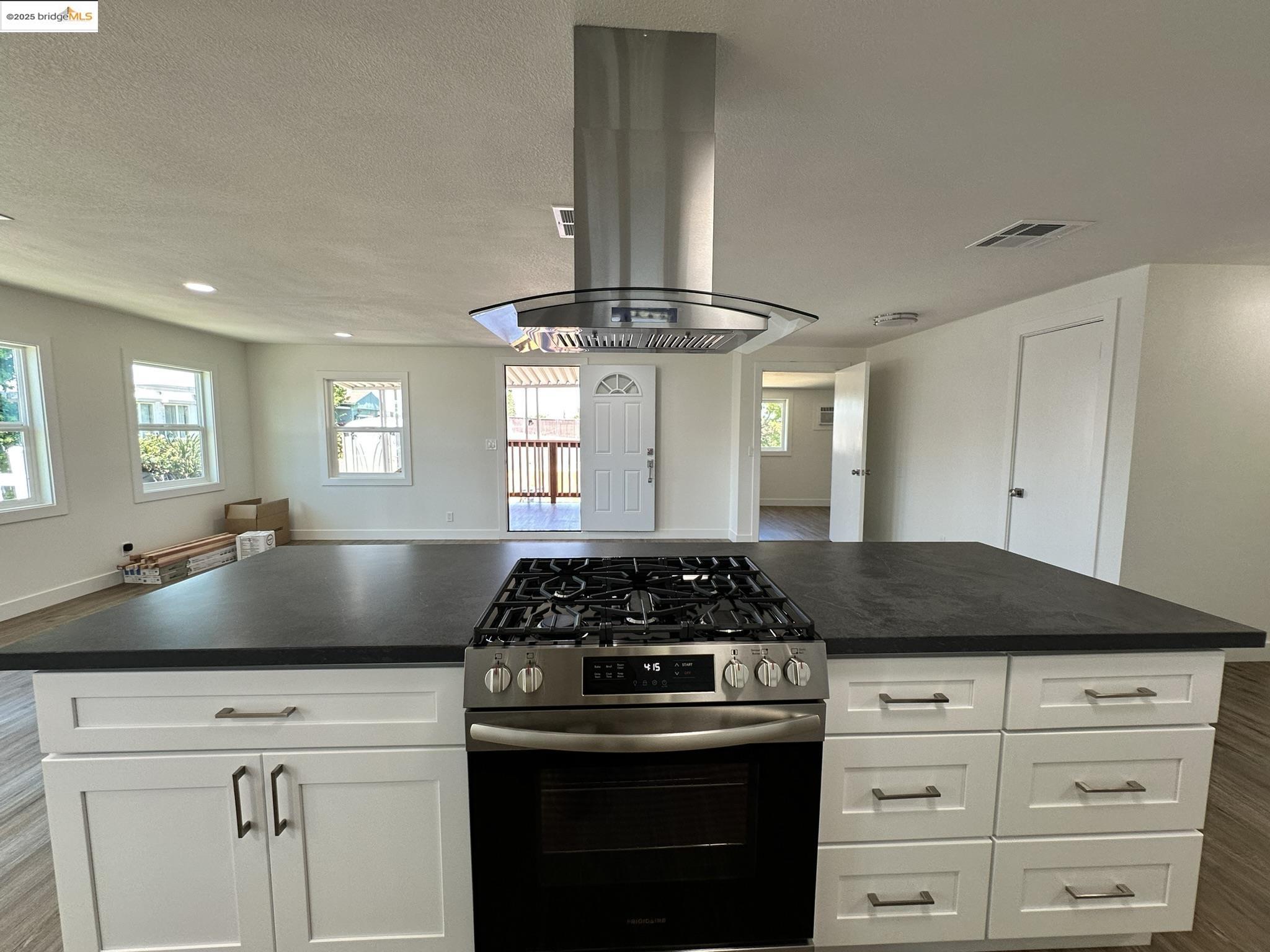 3301 Buchanan Road, Unit 47 Antioch, CA 94509 - Photo 57 of 58 a kitchen with a stove and white cabinets