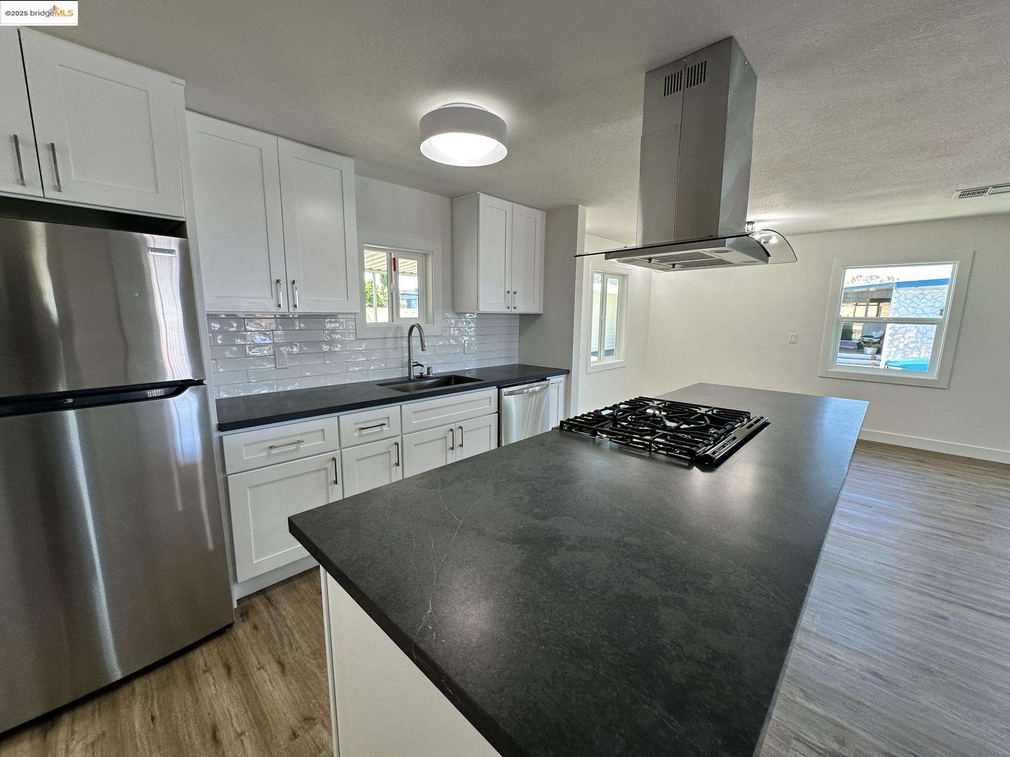 3301 Buchanan Road, Unit 47 Antioch, CA 94509 - Photo 30 of 58 a kitchen with granite countertop a refrigerator and a stove