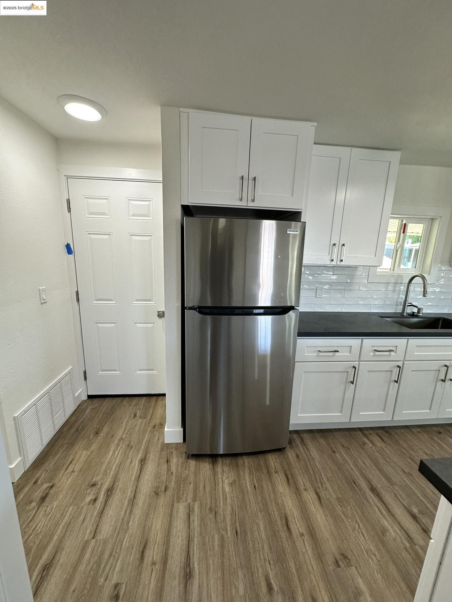 3301 Buchanan Road, Unit 47 Antioch, CA 94509 - Photo 31 of 58 a kitchen with a refrigerator a sink and cabinets