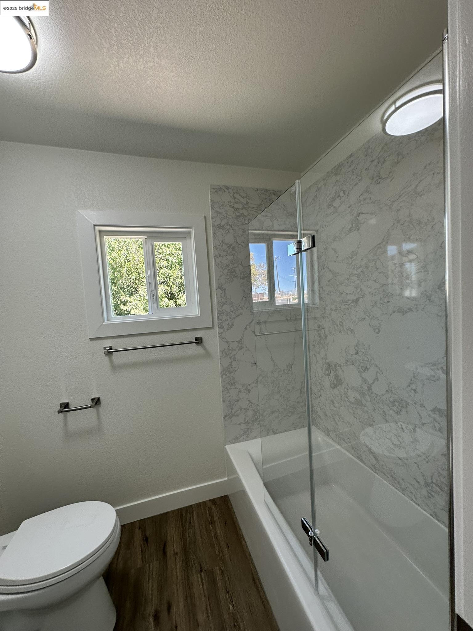 3301 Buchanan Road, Unit 47 Antioch, CA 94509 - Photo 49 of 58 a bathroom with a granite countertop bathtub shower and toilet