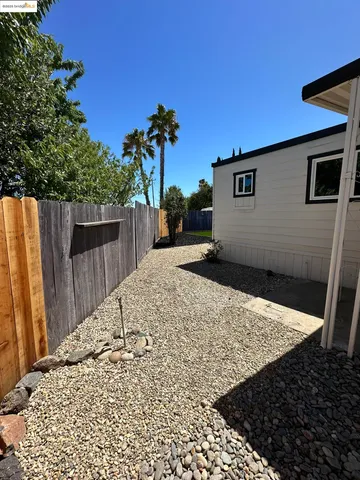 a view of a backyard of the house