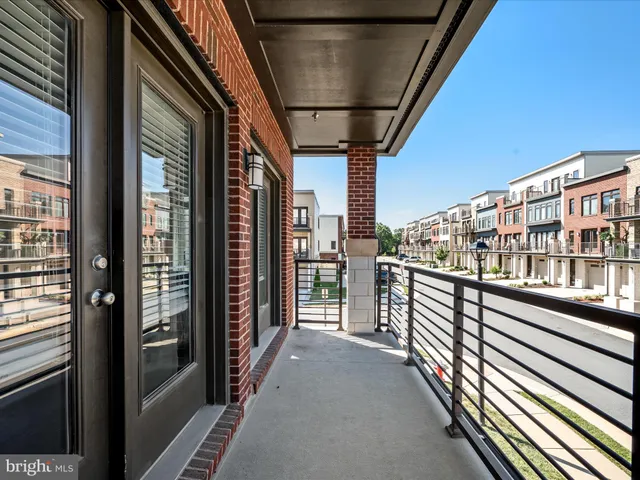 a view of a balcony with wooden floor