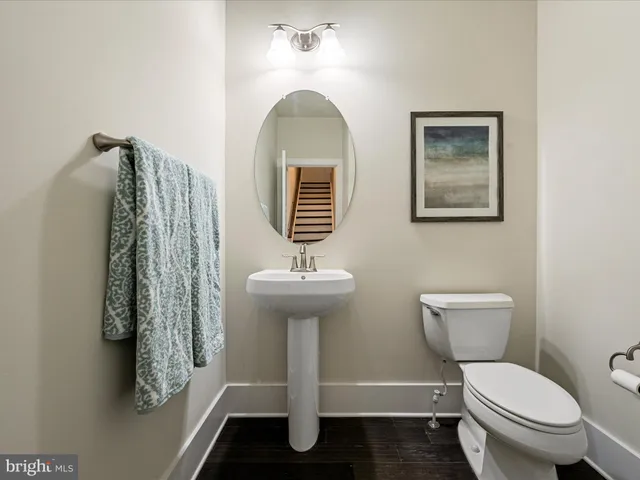 a spacious bedroom with a bed a couch and a dresser next to a window