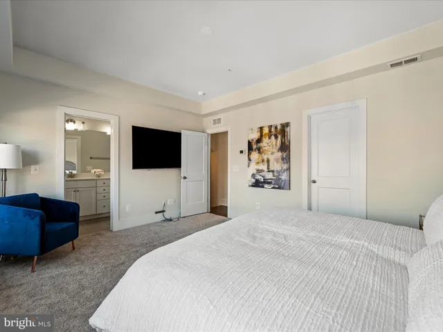 a bathroom with a double vanity sink mirror and shower