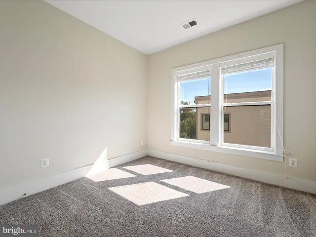 a bathroom with a granite countertop toilet a sink and a bathtub