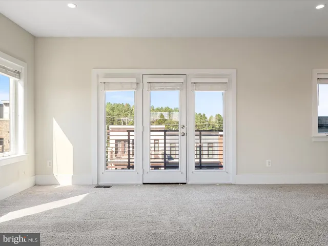 a view of an empty room with stairs