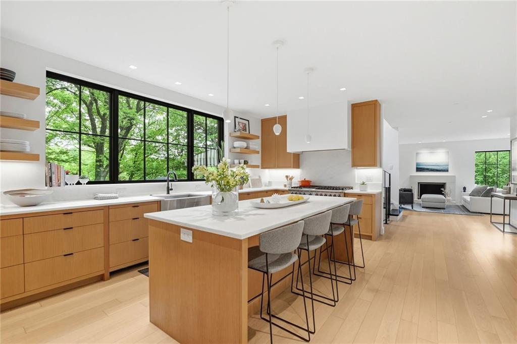 810 Persimmon Road Sewickley, PA 15143 - Photo 9 of 49 The kitchen opens directly to the living room, creating a seamless flow of light and space across the entire main level.
