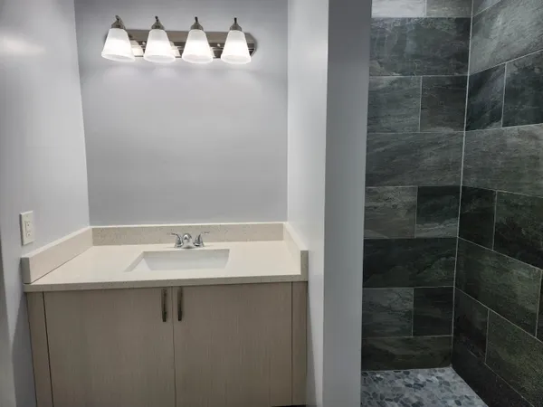 a bathroom with a sink and a mirror