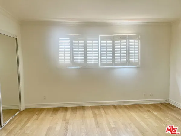an empty room with a empty space and a window