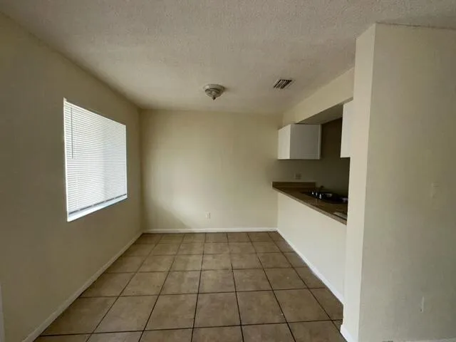 a view of a kitchen with a sink and dishwasher