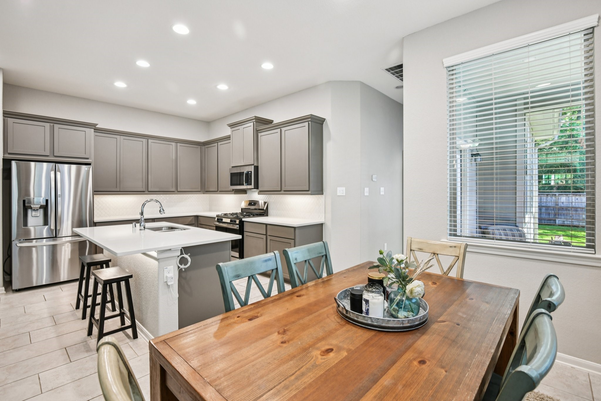 230 Biltmore Loop Montgomery, TX 77316 - Photo 9 of 39 Dining Area just off the kitchen. Hallway behind the kitchen leads to the primary bedroom.