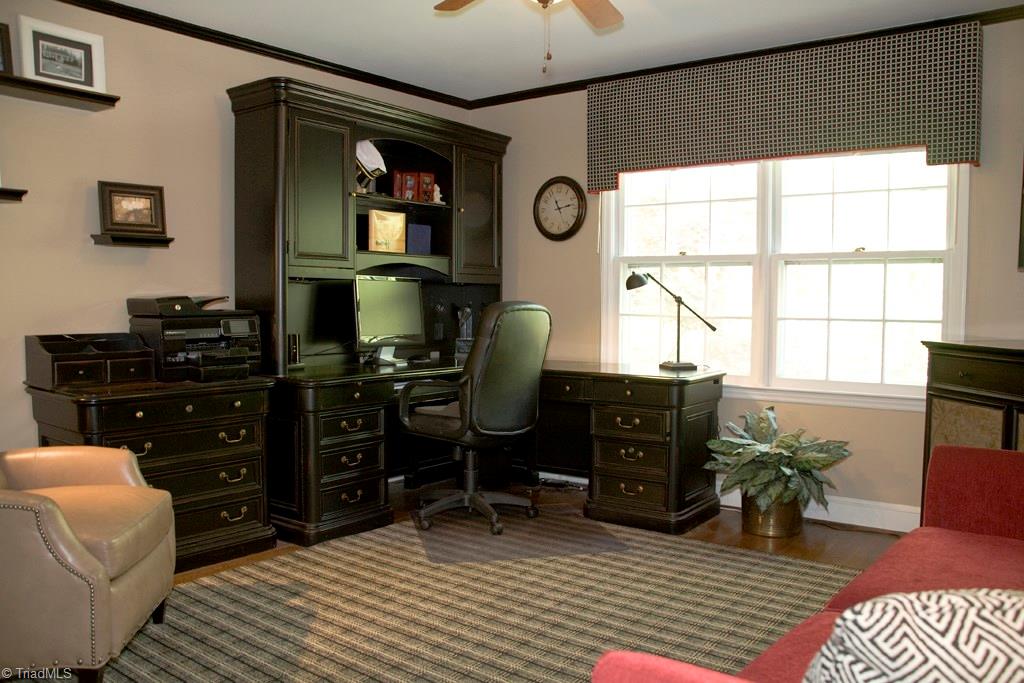 3701 Lewiston Road Greensboro, NC 27410 - Photo 12 of 30 The second downstairs bedroom is located in the rear of the house overlooking the gardens. A pocket door and separate outside entrance can make this a private suite with a full bath.