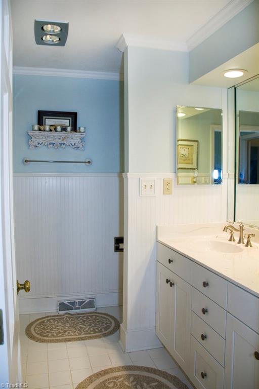 3701 Lewiston Road Greensboro, NC 27410 - Photo 15 of 30 Another updated bath with beaded board wainscoting.