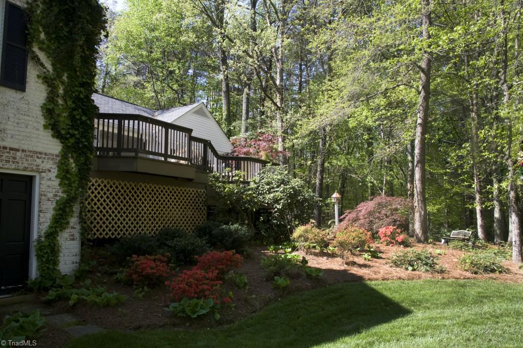 3701 Lewiston Road Greensboro, NC 27410 - Photo 20 of 30 Rear gardens are delightful. The walk-in unfinished basement (no direct connection to house) offers the perfect place for outdoor furniture storage, workshop or exercise room!