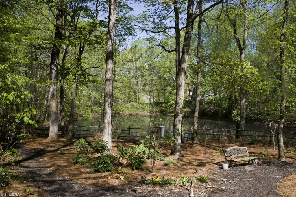 3701 Lewiston Road Greensboro, NC 27410 - Photo 22 of 30 The spring-fed pond has a dock and provides water views year around. The house roof is under a year old and the HVAC system are both between 5 & 10 Years.