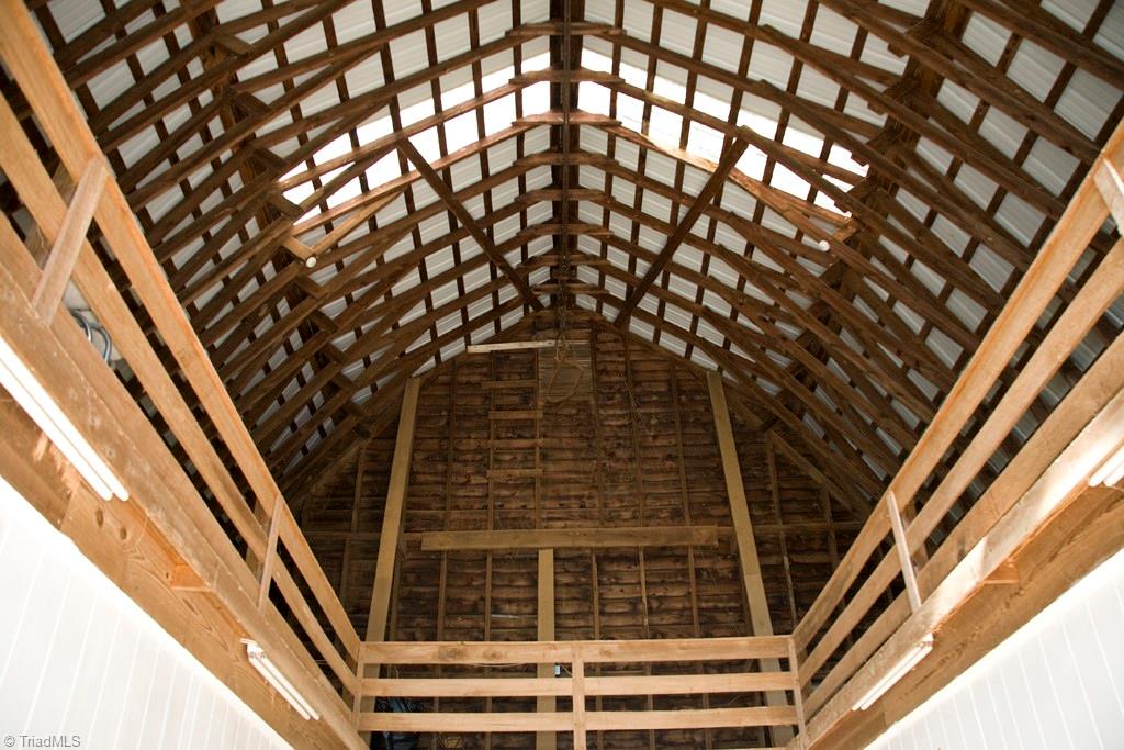 3701 Lewiston Road Greensboro, NC 27410 - Photo 28 of 30 The roof structure is so interesting. Plenty of storage room for tack trucks, hay or whatever!