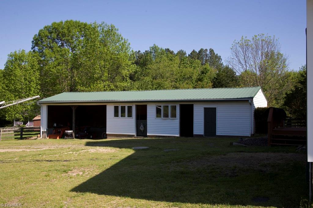 3701 Lewiston Road Greensboro, NC 27410 - Photo 30 of 30 Rear shed for equipment, sawdust, and possibly several more stalls. Hotwalker included.