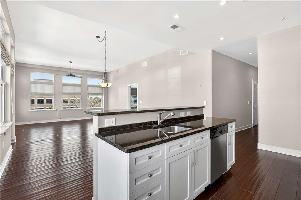 201 West Ponce De Leon Avenue, Unit 702 Decatur, GA 30030 - Photo 5 of 41 a kitchen with a sink and stove