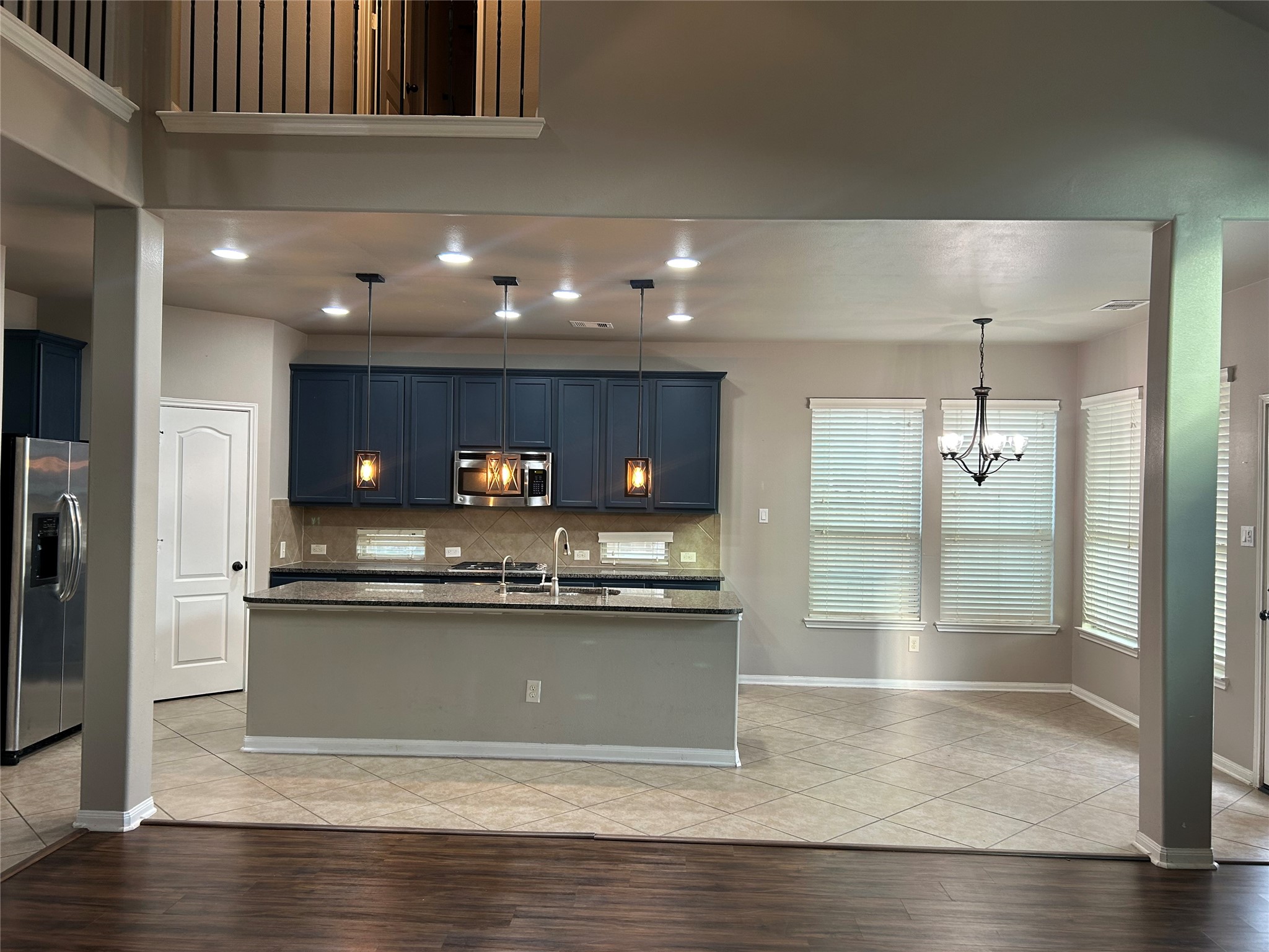 7936 Lake Commons Drive Rosenberg, TX 77469 - Photo 13 of 33 a kitchen with stainless steel appliances granite countertop a sink and a stove
