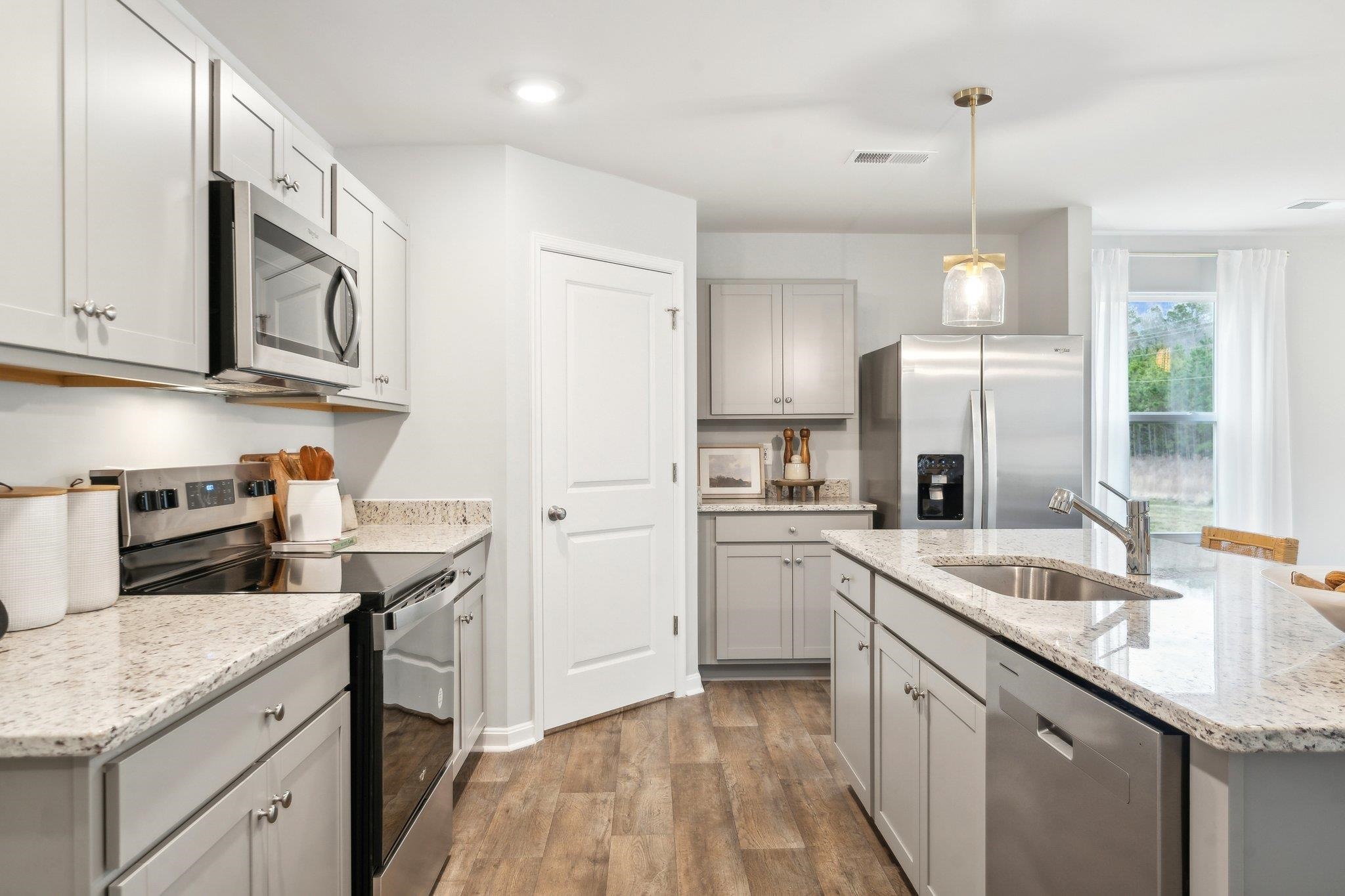 557 Summercrest Avenue Waynesboro, VA 22980 - Photo 13 of 26 a kitchen with stainless steel appliances granite countertop a sink stove and refrigerator