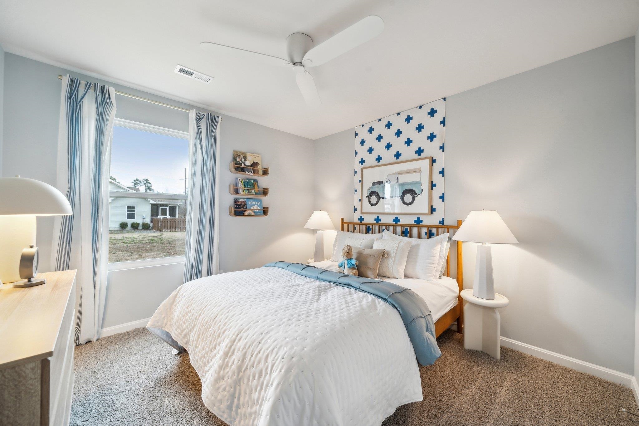 557 Summercrest Avenue Waynesboro, VA 22980 - Photo 6 of 26 a bedroom with a large bed and a chandelier