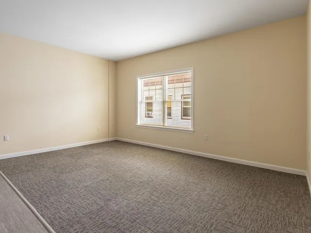 an empty room with a empty space and window