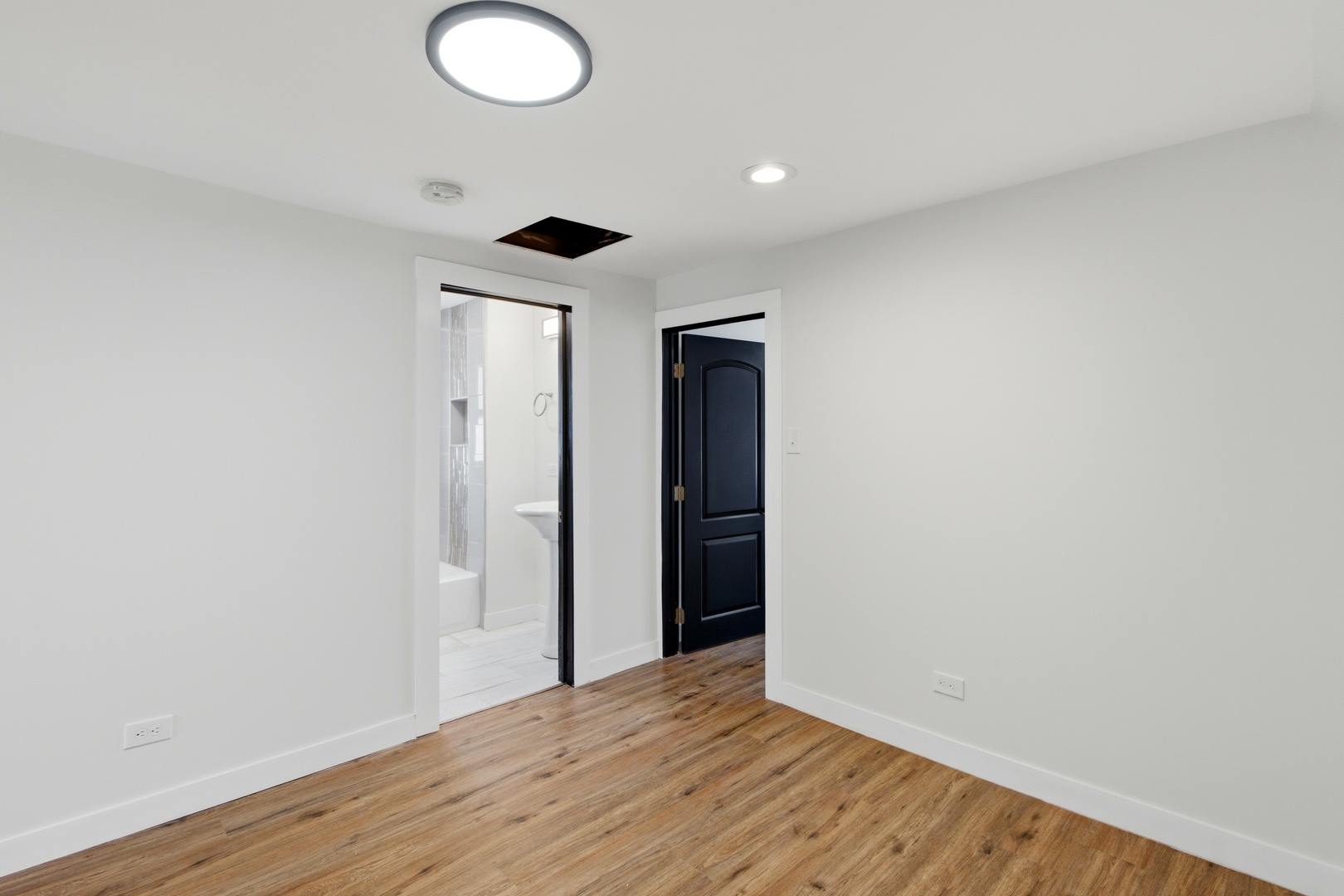 8942 South Aberdeen Street Chicago, IL 60620 - Photo 15 of 35 a view of an empty room with wooden floor