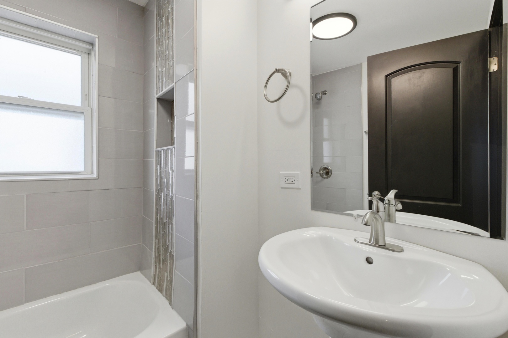 8942 South Aberdeen Street Chicago, IL 60620 - Photo 23 of 35 a bathroom with a sink and a mirror