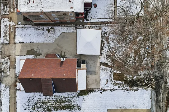 a aerial view of a house with a yard