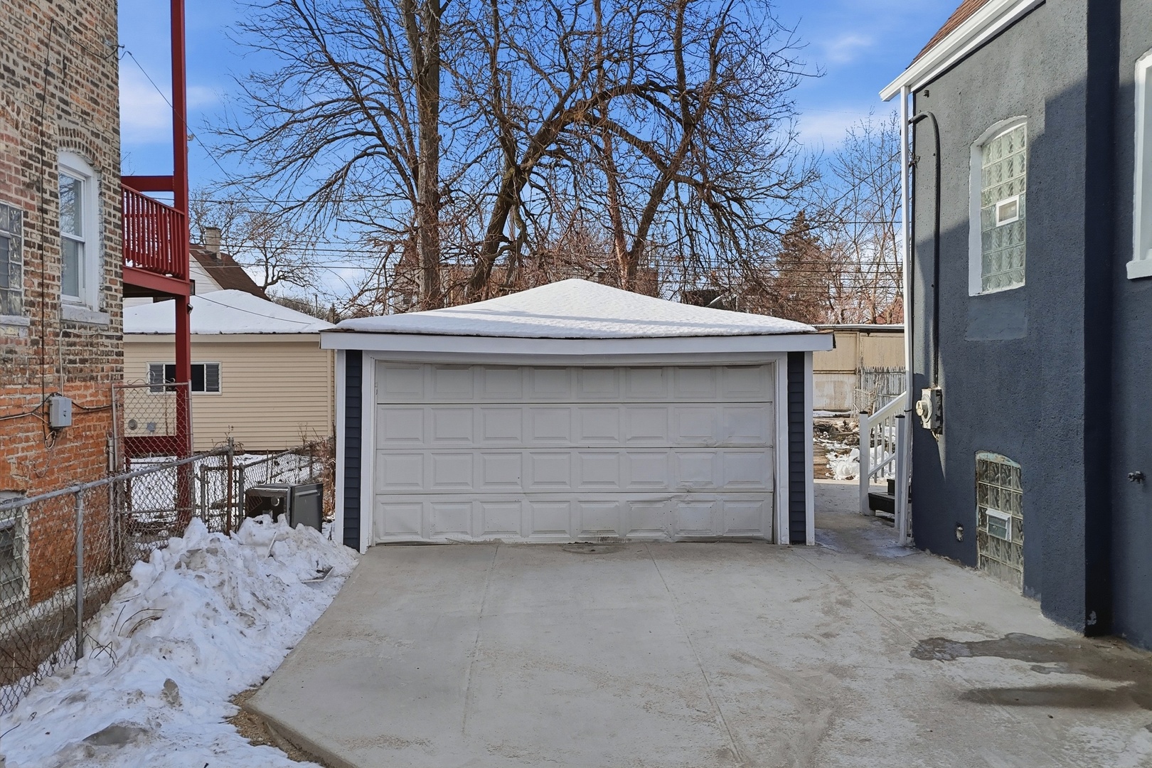 8942 South Aberdeen Street Chicago, IL 60620 - Photo 30 of 35 a front view of a house with a yard and garage