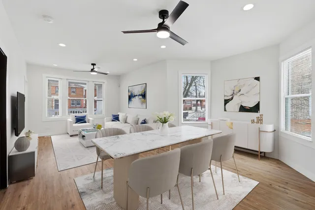 a view of a dining room with furniture and wooden floor