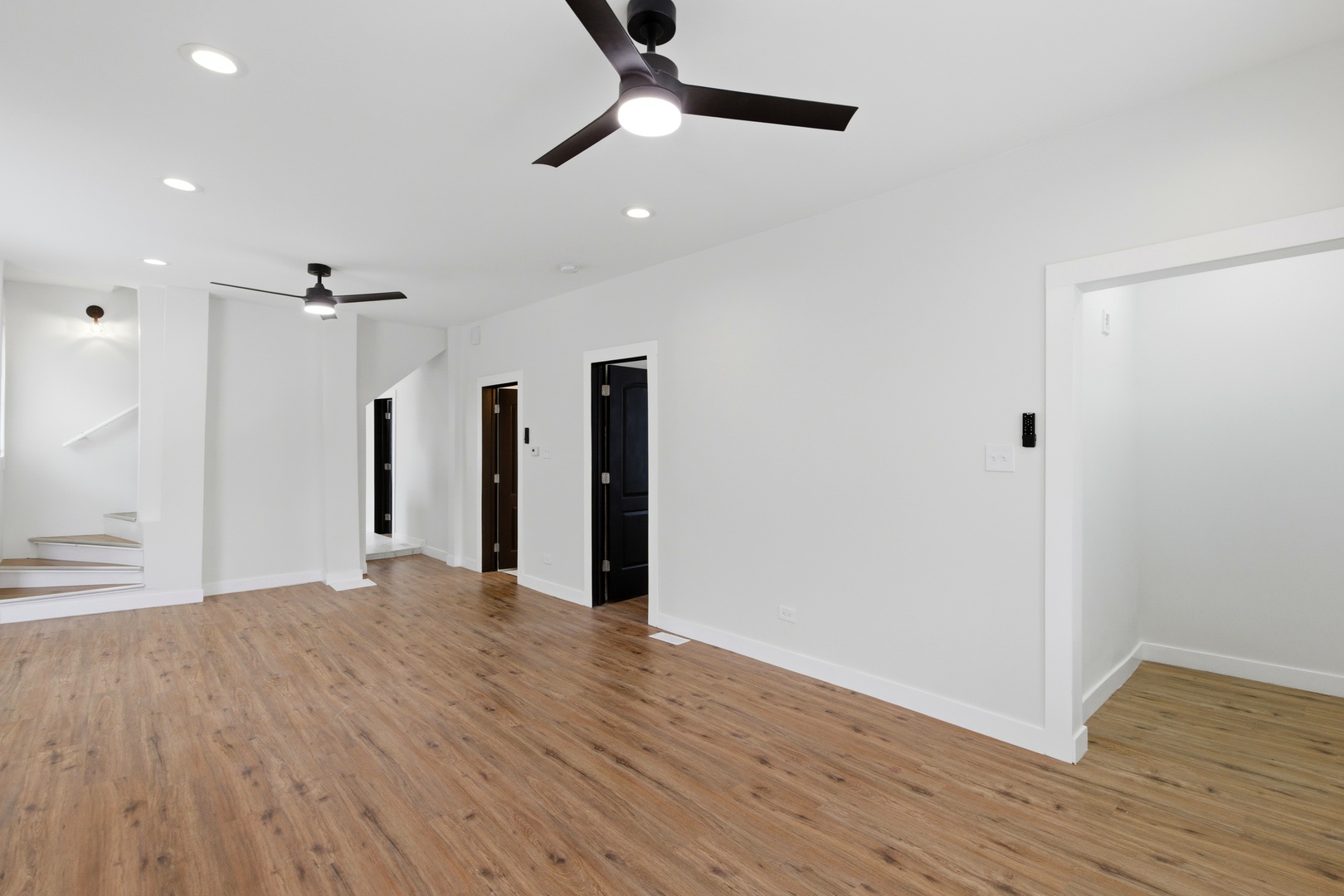 8942 South Aberdeen Street Chicago, IL 60620 - Photo 6 of 35 a view of an empty room with wooden floor