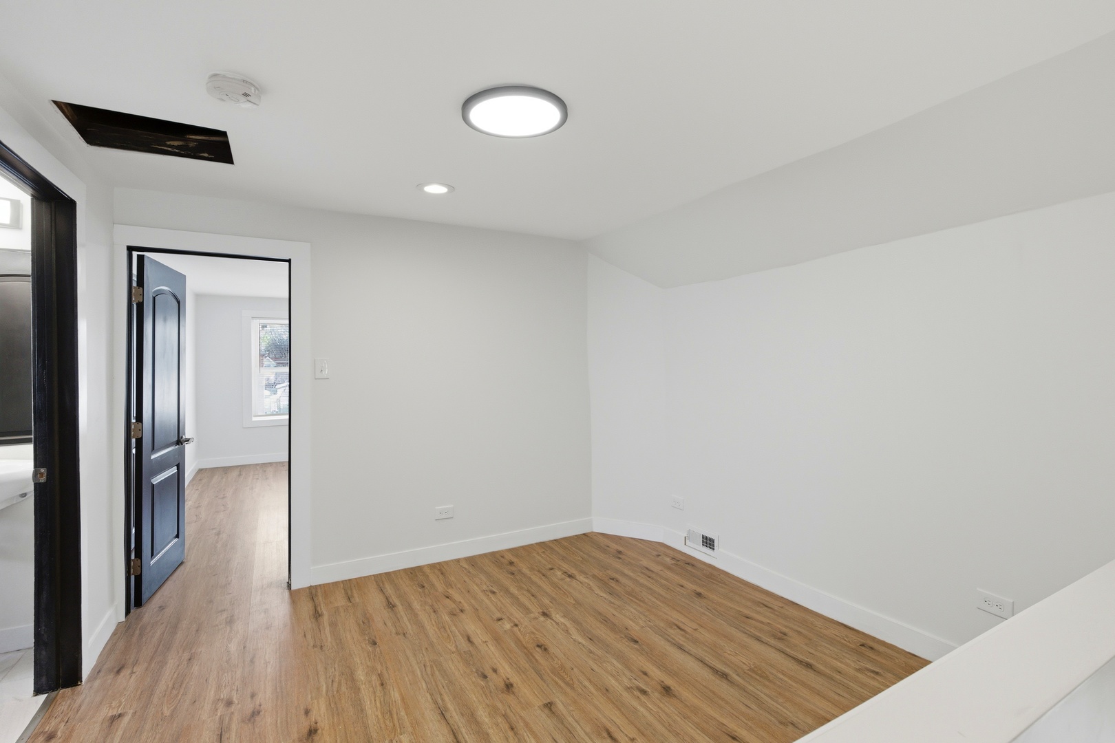 8942 South Aberdeen Street Chicago, IL 60620 - Photo 10 of 35 wooden floor in an empty room