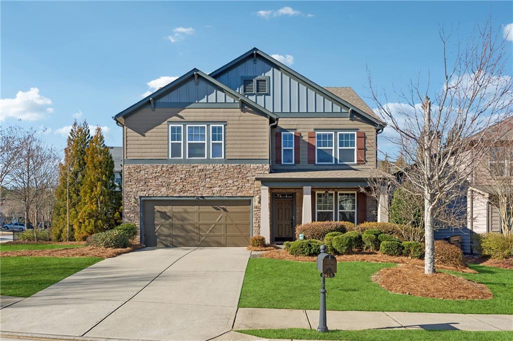 3645 Canopy Chase Cumming, GA 30041 - Photo 1 of 1 a front view of a house with a yard and garage