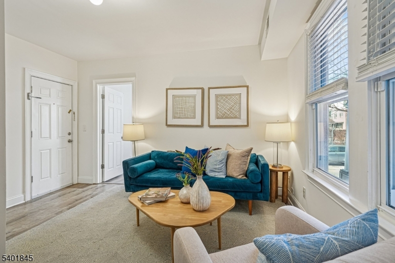 9 Wheeler Street Montclair, NJ 07042 - Photo 2 of 13 a living room with furniture and a large window