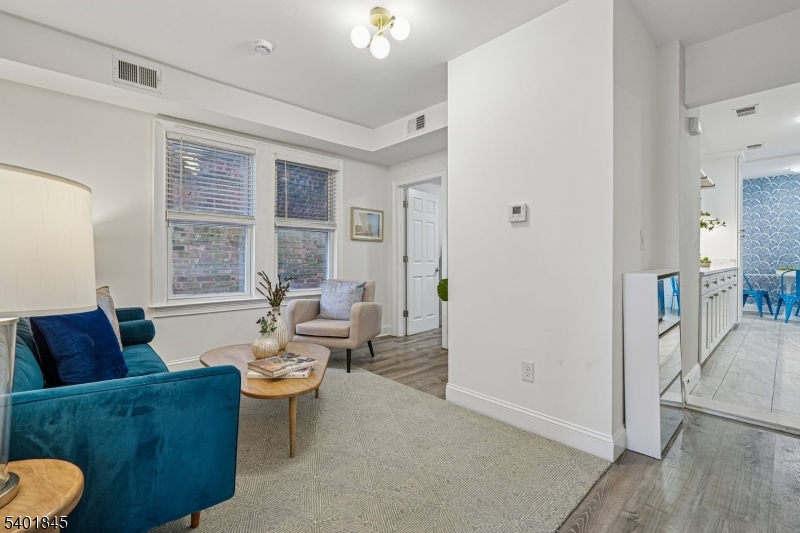 9 Wheeler Street Montclair, NJ 07042 - Photo 3 of 13 a living room with furniture and a large window