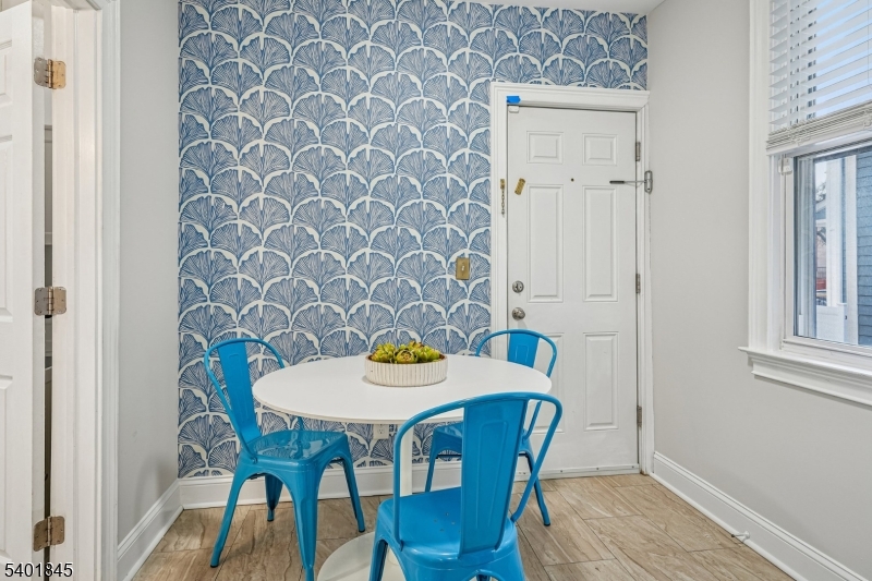 9 Wheeler Street Montclair, NJ 07042 - Photo 4 of 13 a view of a dining room with furniture and wooden floor