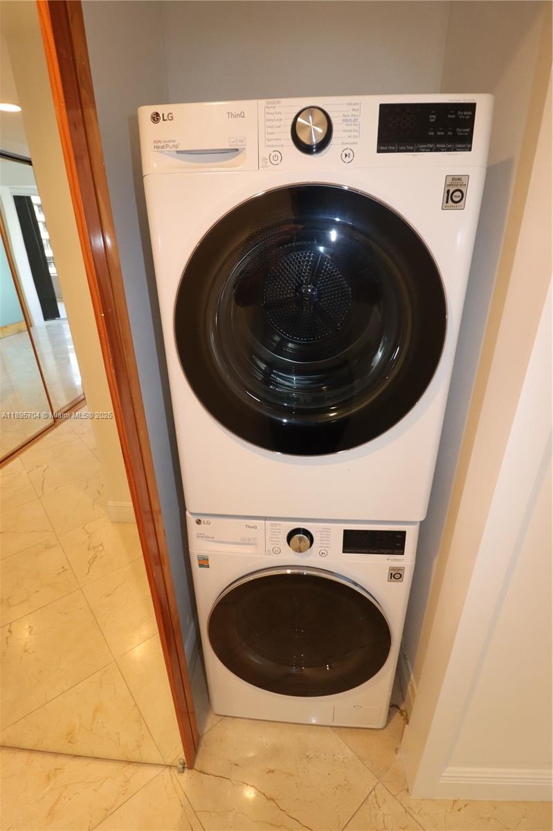 201 Crandon Boulevard, Unit 636 Key Biscayne, FL 33149 - Photo 15 of 53 a utility room with dryer and washer