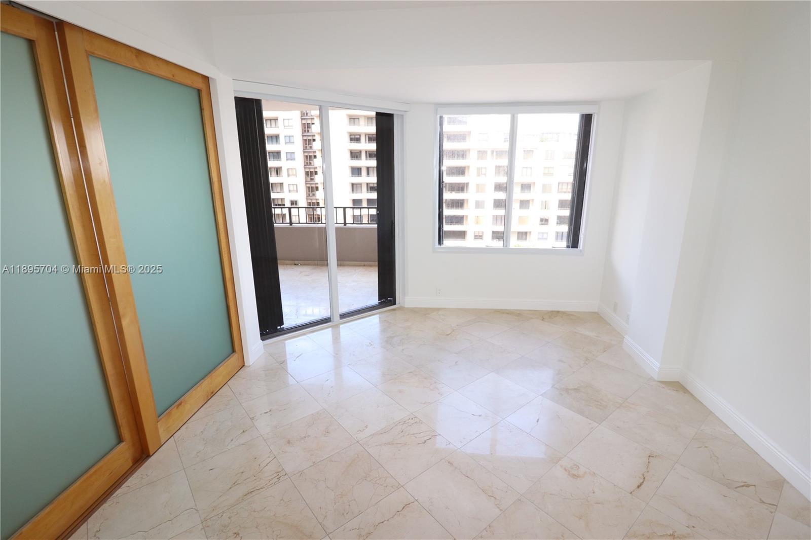 201 Crandon Boulevard, Unit 636 Key Biscayne, FL 33149 - Photo 17 of 53 an empty room with windows