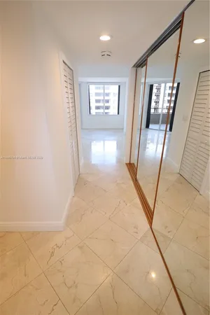 a bathroom with a tub sink and a mirror