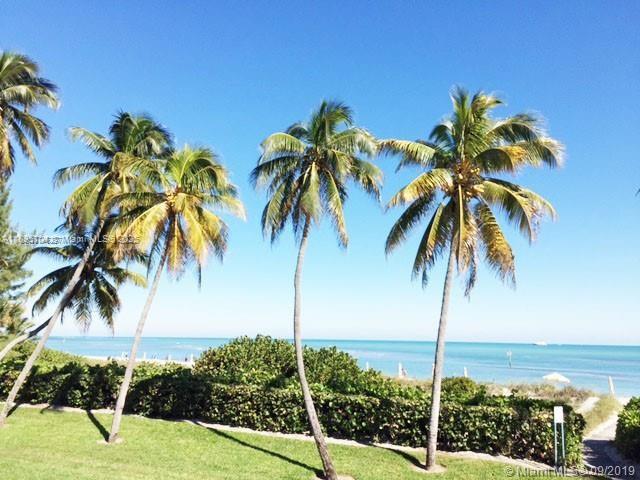 201 Crandon Boulevard, Unit 636 Key Biscayne, FL 33149 - Photo 44 of 53 a view of three palm trees
