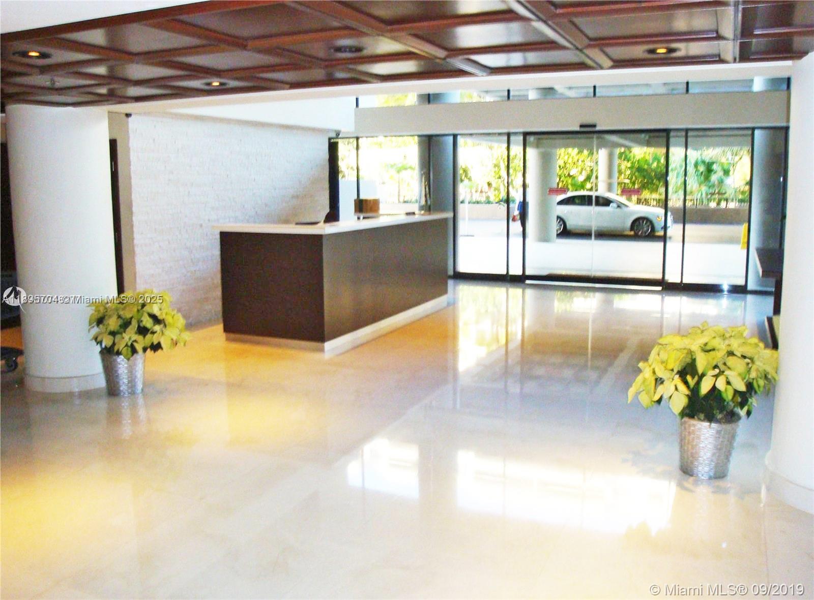 201 Crandon Boulevard, Unit 636 Key Biscayne, FL 33149 - Photo 45 of 53 a lobby with furniture and potted plant