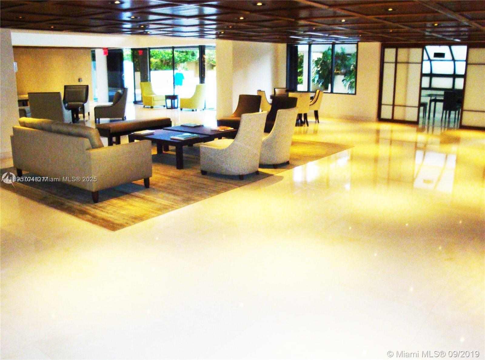 201 Crandon Boulevard, Unit 636 Key Biscayne, FL 33149 - Photo 48 of 53 a living room with furniture and a large window