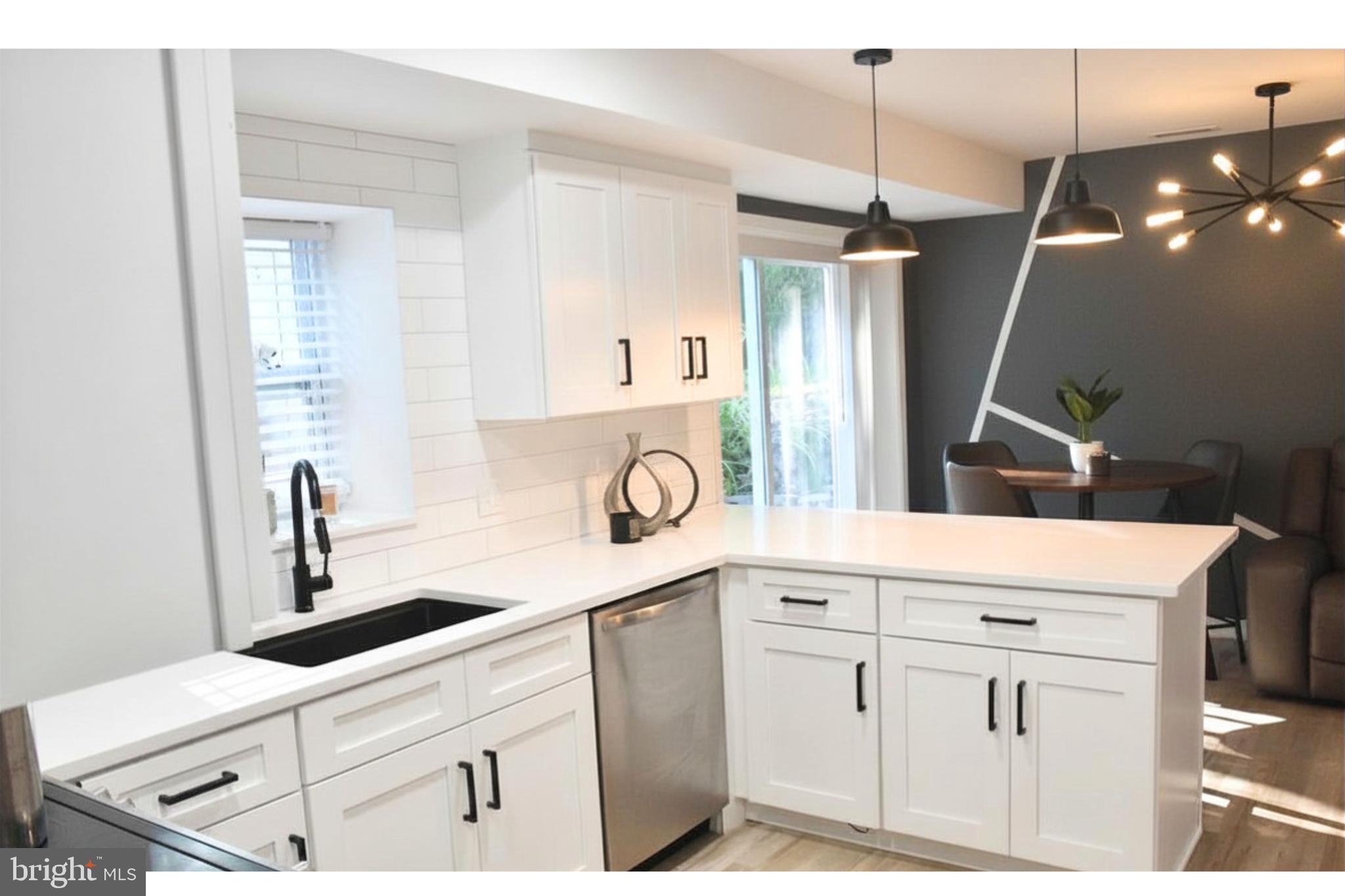 17930 Masemore Road Parkton, MD 21120 - Photo 11 of 46 a kitchen with white cabinets and white appliances