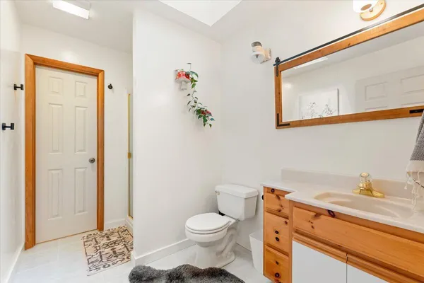 a bedroom with a bed and large windows